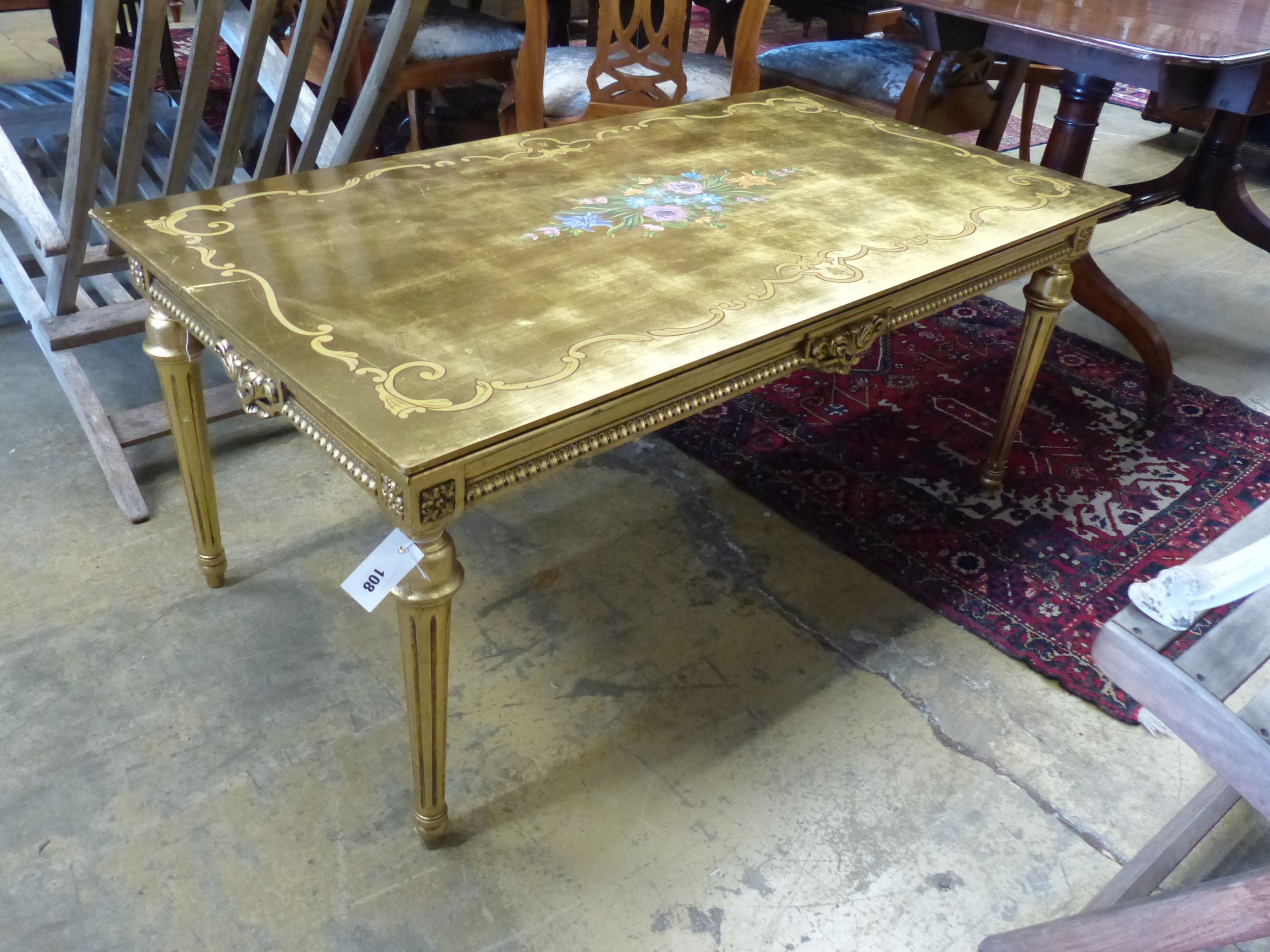A rectangular painted gilt coffee table, width 125cm, depth 67cm, height 55cm